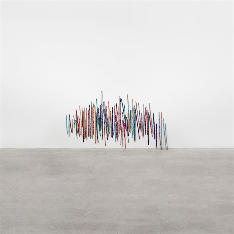 Sheila Hicks, Talking Sticks, 2021-23, linen, cotton, silk, nylon and bamboo, 241 x 375 cm (94 7/8 x 147 5/8 in); installation dimensions variable. Courtesy: © Sheila Hicks and Alison Jacques, London.