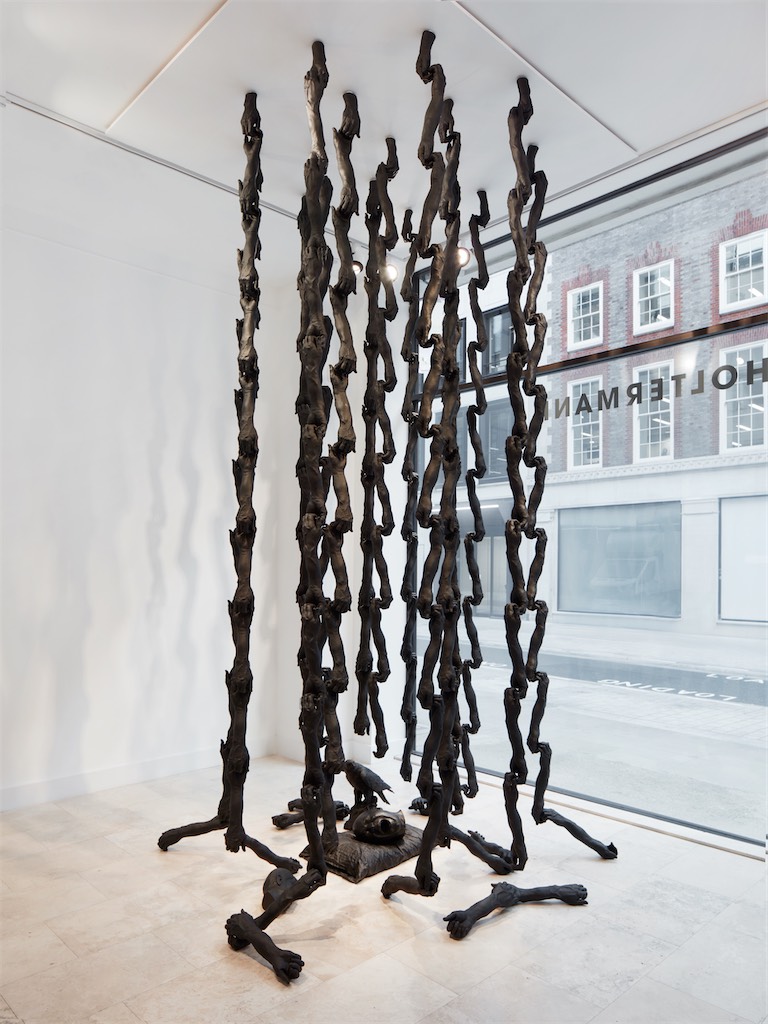 Nick Cave / Chain Reaction, 2022-2023 / Resin and metal with bronze components / 15 lines of 15 wrists and 160 arms, installed in 3 concentric circles, 1 bronze pillow, 2 bronze heads, 1 bronze eagle / 395 x 210 x 210 cm / 155 1/2 x 82 5/8 x 82 5/8 in / Dimensions variable / Courtesy of the artist and Holtermann Fine Art 