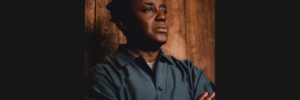 Portrait of John Akomfrah. Photographer: Christian Cassiel ©️ John Akomfrah; Courtesy Lisson Gallery