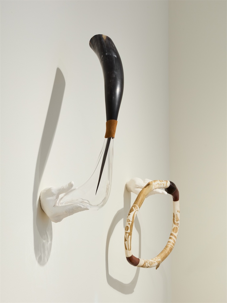 Ahmed Umar, Glowing Phalanges, 2026, one work in 15 parts, mixed media including found wood, ebony, cow horn, leather, reindeer antler, glass, horsehair, mother of pearl hung on cast acrylic hands, variable dimensions from ca 15x15cm to ca 45x30cm. Courtesy the artist and Holtermann Fine Art